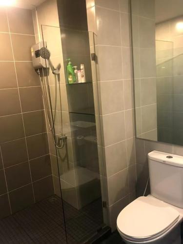 a bathroom with a glass shower with a toilet at Owow o2 in Bang Chak