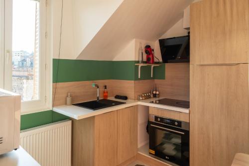 Η κουζίνα ή μικρή κουζίνα στο Appartement Moderne, Confortable et Bien Situé