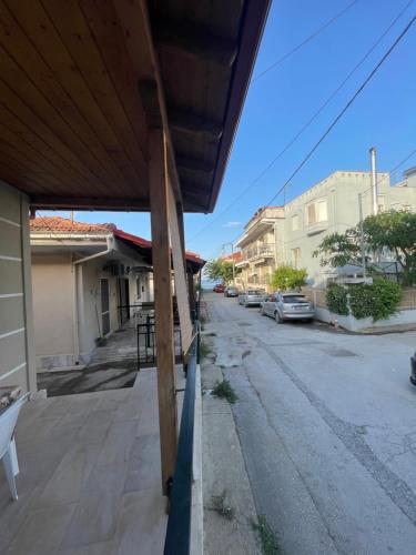 a view of an empty street with a house at Anastelia Apartments - The Backyard in Olympiada