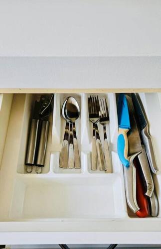 a group of utensils are arranged in a drawer at Kalgoorlie, Unit 2, Golden Patch Retreat in Boulder