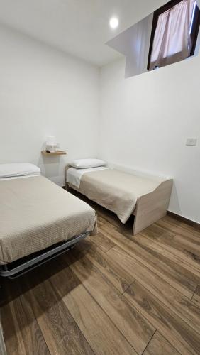 Postel nebo postele na pokoji v ubytování Nel Cuore del Borgo
