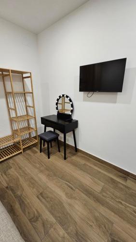 TV a/nebo společenská místnost v ubytování Nel Cuore del Borgo