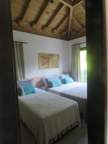 Ένα ή περισσότερα κρεβάτια σε δωμάτιο στο Vila encanto