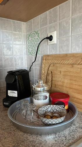 a tray on a counter with a coffee maker and a toaster at ANASA in Stavros