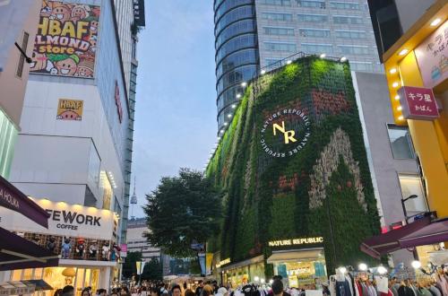 a crowd of people in a city with buildings at Huga Inn in Seoul