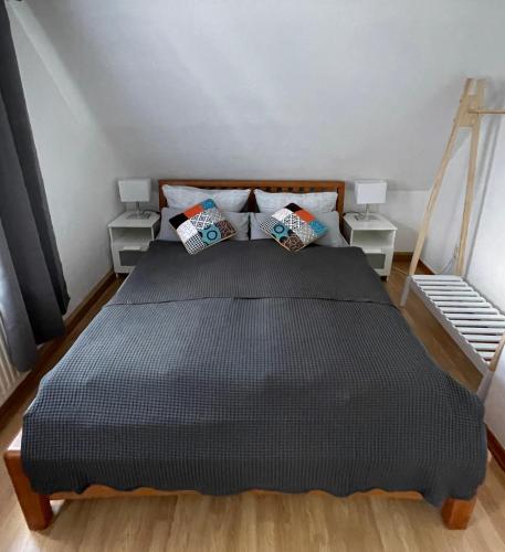 a bedroom with a bed with two night stands at Ferienapartment Weimar Altstadt 2 in Weimar