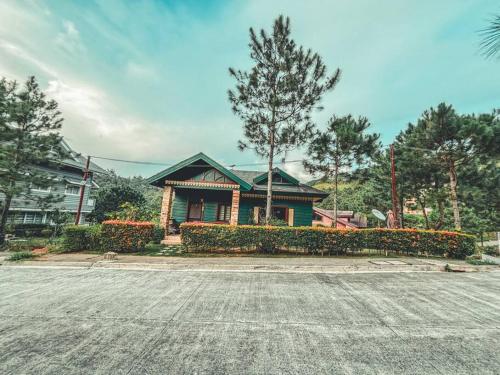 a house sitting on the side of a street at Insta-Worthy Swiss House Staycation Crosswinds Tagaytay in Tagaytay