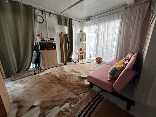 Posteľ alebo postele v izbe v ubytovaní Tiny House am Neusiedlersee