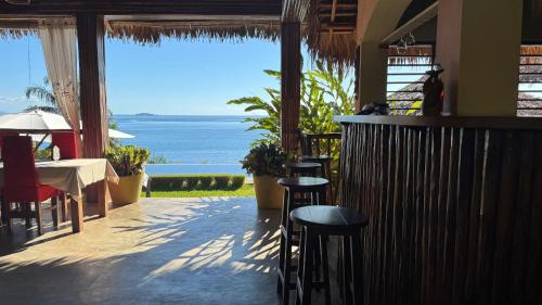 a restaurant with a view of the ocean at VERONIKA Resort Nosy Komba in Nosy Komba