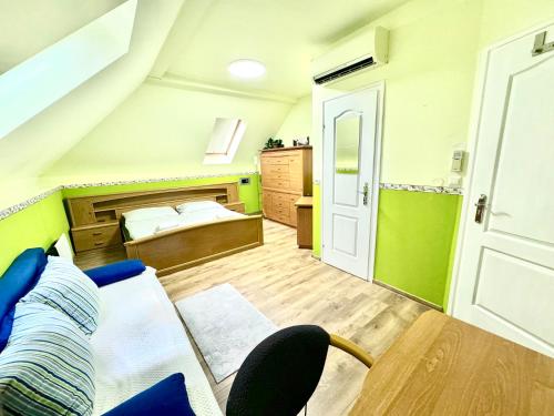 a small room with a bed and a table at Privát Adriana in Kremnica