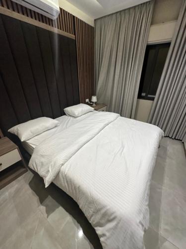 Ένα ή περισσότερα κρεβάτια σε δωμάτιο στο Chic Apartments For Rent ave1-1