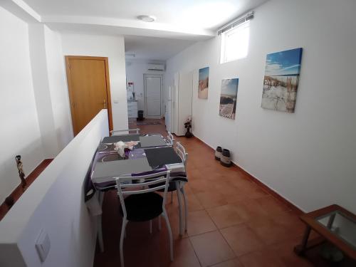 a room with a table and chairs in it at Sweet Sleep Apartment in Lisbon
