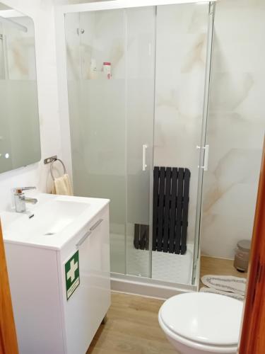 a bathroom with a shower and a sink and a toilet at Sweet Sleep Apartment in Lisbon