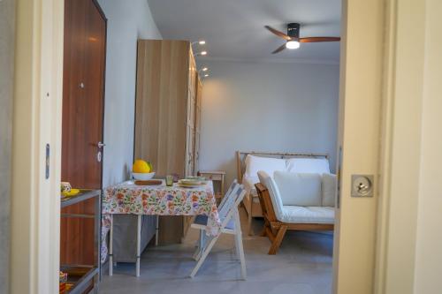 a small room with a table and a chair at R-HOME Acicastello in Aci Castello