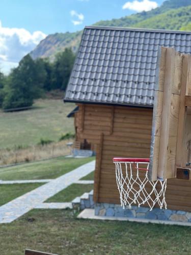a basketball hoop on the side of a building at Soulrest EkoResort - Mehov Konak in Gusinje