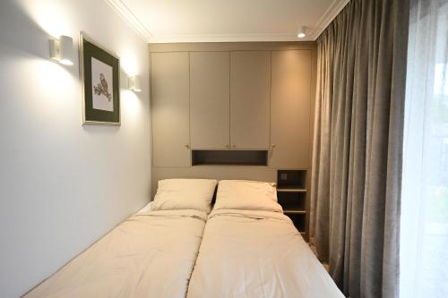 a small room with a bed in the corner at Port Rewa in Rewa