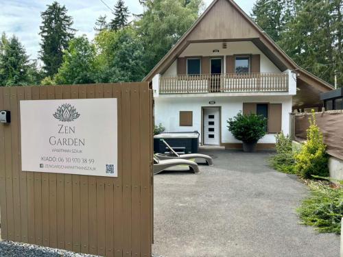 a sign in front of a house at Zen Garden Szajki Tavak in Hosszúpereszteg