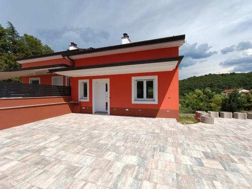 a small house with a large driveway at Apartma LANA in Koper