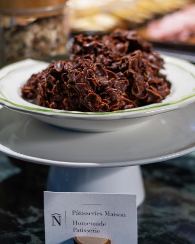a plate of chocolate cake on a white plate at Hôtel & SPA Napoléon in Fontainebleau