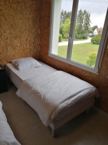 Katil atau katil-katil dalam bilik di Gîte mon papi - 18 personnes