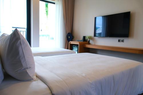 TV/Unterhaltungsangebot in der Unterkunft Indigen Riverside Hotel Cao Bang