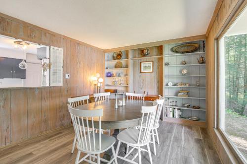 a dining room with a wooden table and chairs at Water-View Home in the Berkshires in Sheffield