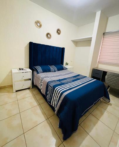 Postel nebo postele na pokoji v ubytování Agradable Departamento San Rafael