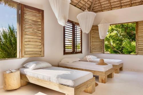 Giường trong phòng chung tại Casa Santa Maria Tatajuba