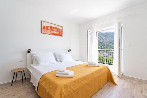 Ένα ή περισσότερα κρεβάτια σε δωμάτιο στο Villa Osinium