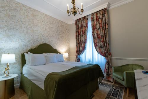 Кровать или кровати в номере Hotel Palace