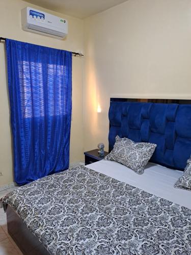Ένα ή περισσότερα κρεβάτια σε δωμάτιο στο Appartement meublé, Zac Mbao, Rufisque