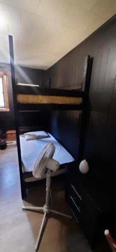 a bedroom with two bunk beds and a desk at The International House Hostel in Quebec City
