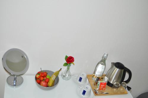 a table with a mirror and a bowl of fruit at långstorp in Höör