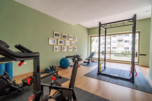 a gym with several treadmills and exercise equipment at AeroHarmony in Nouaceur