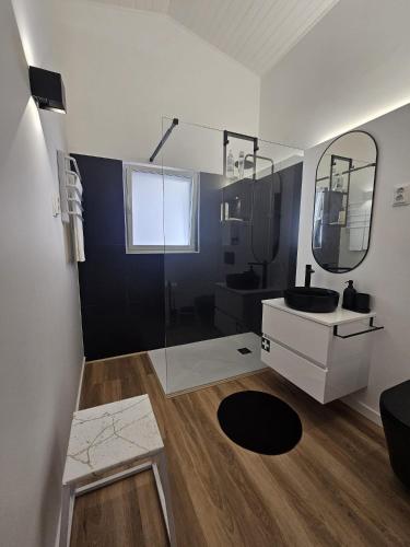 a bathroom with a shower and a sink and a mirror at Sunflower Castle View in Óbidos in Óbidos