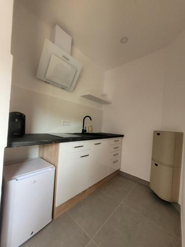 Kuchyň nebo kuchyňský kout v ubytování Reload Apartments - FeWo2 im Remmeker Feld