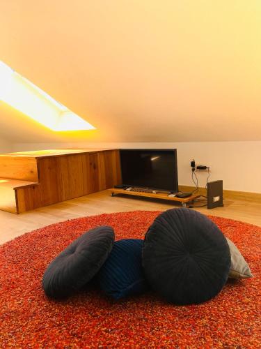 a room with a bean bag chair on a rug at RA PARAISO in Lisbon