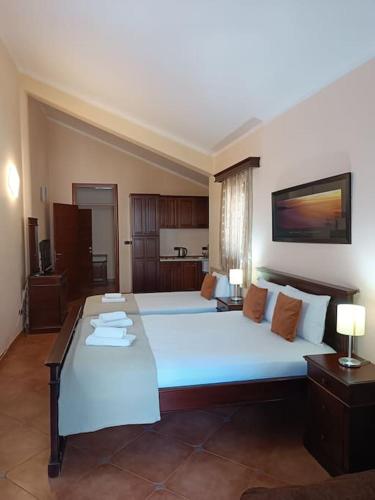 a large bedroom with a large white bed in a room at Villa Roselina By Beatrix in Budva