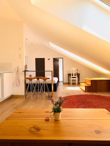 a living room with a bed and a table at RA PARAISO in Lisbon