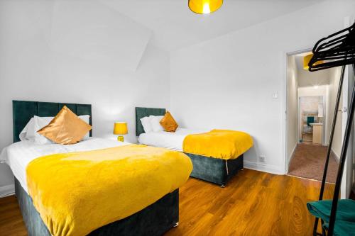 En eller flere senge i et værelse på Willes Road City House