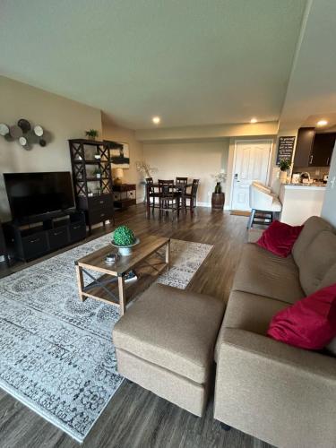 a living room with a couch and a table at Spacious 2 Bedroom 2 Bathroom Apartment with Balcony in Uptown Charlotte! City Views & Free Parking! in Charlotte