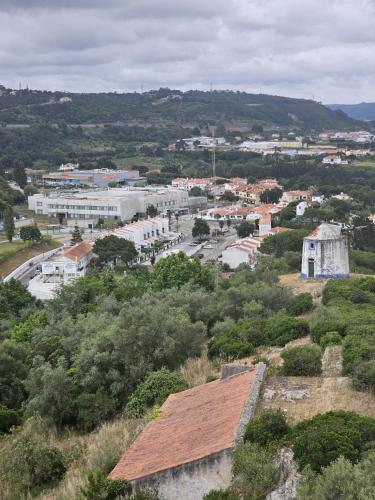 an aerial view of a town with buildings and trees at Sunflower Castle View in Óbidos in Óbidos