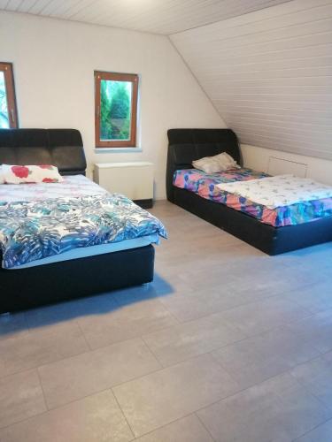 two beds sitting in a room with at OAz in Ehingen