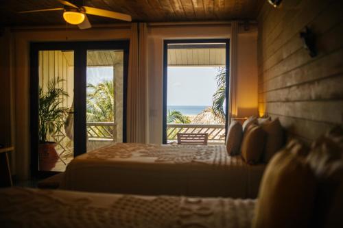 Letto o letti in una camera di Tranquilseas Eco Lodge & Dive Center