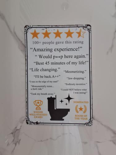 a sign on a wall with a toilet on it at Sunny Waves in Northampton