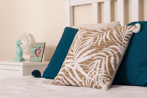 Una cama o camas en una habitación de Amelia Villa Collection
