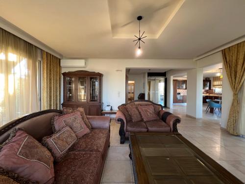 a living room with two couches and a couch at Joyful Guest Houses by 8essentially in Chania Town