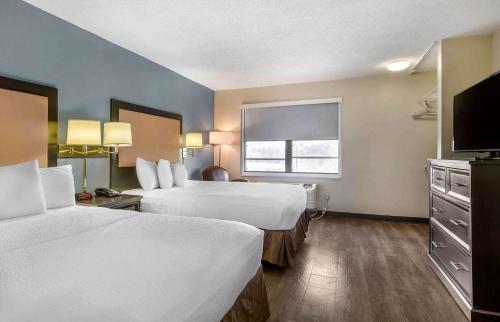 a hotel room with two beds and a window at Extended Stay America Suites - Fishkill - Westage Center in Fishkill