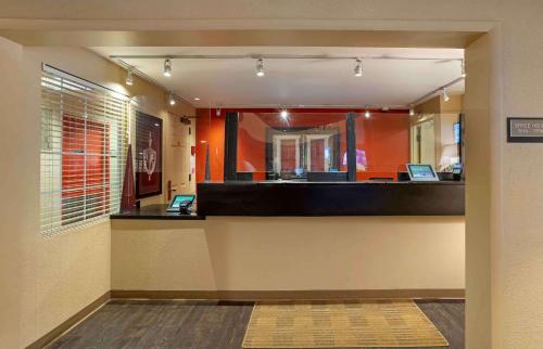 an office with a reception desk with a mirror at Extended Stay America Suites - Fishkill - Route 9 in Fishkill
