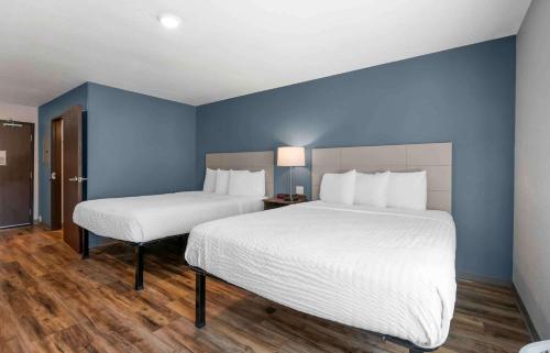 Ένα ή περισσότερα κρεβάτια σε δωμάτιο στο Extended Stay America Select Suites - Melbourne - West Melbourne